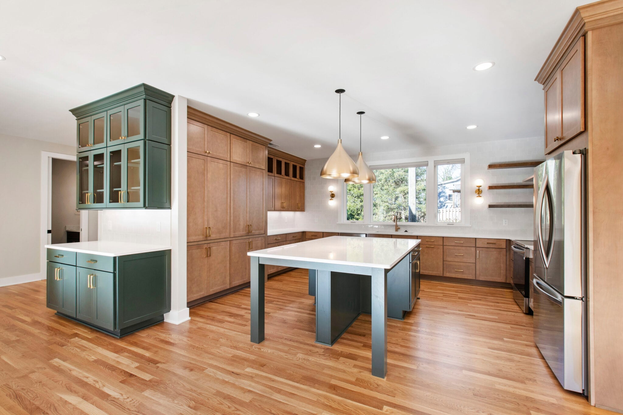 NW 10th St Ankeny 11 | CoCreations Construction & Design | CoCreations Construction & Design Kitchen with wood cabinetry, center island, and pendant lighting | CoCreations Construction & Design | CoCreations Construction & Design