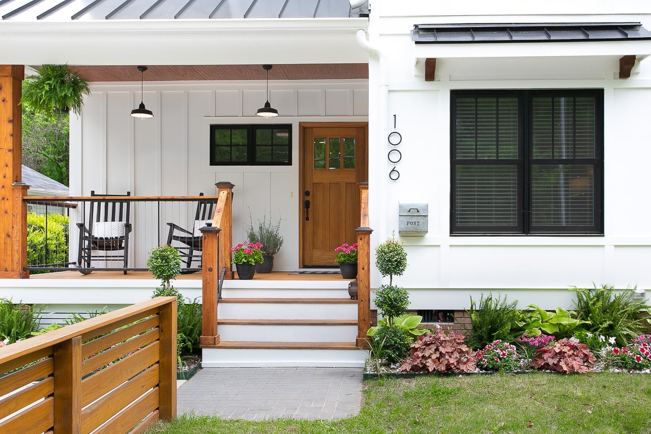 NW 10th St Ankeny 14 | CoCreations Construction & Design | CoCreations Construction & Design Modern white house entry with porch steps and wood front door | CoCreations Construction & Design | CoCreations Construction & Design